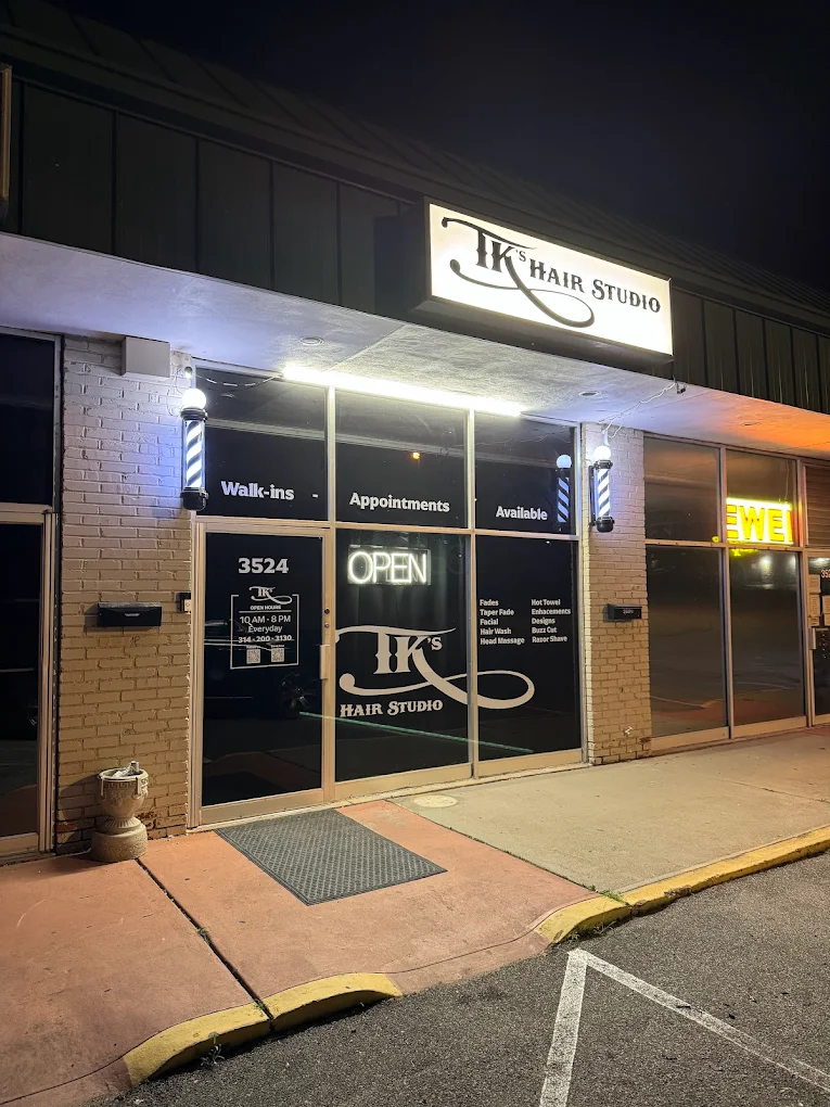 TK's Studio storefront at night